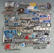Collection of car badges and insignia including Ford, Alfa Romeo, Hillman, DKW Auto Union, Riley,