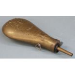 Brass powder flask with embossed decoration and 'US' shield to both sides, 23.5cm long.