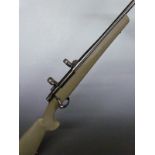 Howa Model 1500 6.5x55 bolt-action rifle with semi-pistol grip, sling suspension and scope mounts