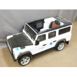 Child's electric Land Rover Defender ride on toy car with parental remote control, LED lights, power
