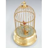 20thC singing birds automata with two birds in gilt metal cage, H28cm