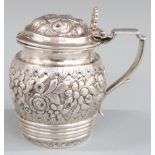 Continental white metal mustard with embossed decoration, possibly Austrian together with a French