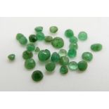 Twenty seven round cut loose emeralds of South Colombian origin