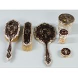 Circa George V hallmarked silver and piqué work tortoiseshell dressing table set comprising hand