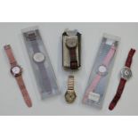 Six Swatch wristwatches including some chronographs and some in original boxes.