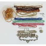 A collection of costume jewellery including paste brooch, beads, paste necklace etc