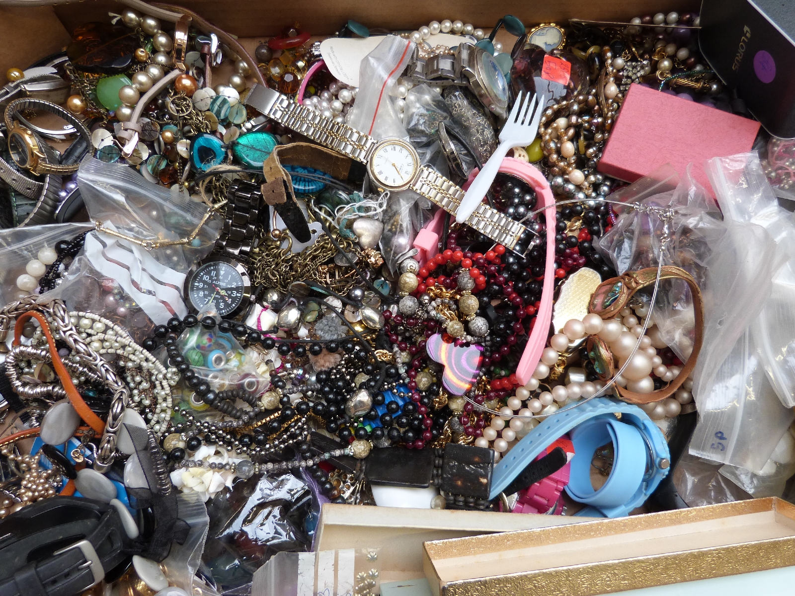 A collection of costume jewellery including watches, beads etc