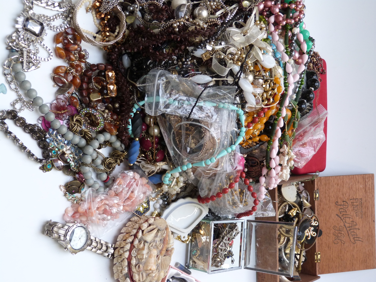A collection of jewellery including necklaces, brooches, earrings etc