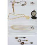 A collection of costume jewellery including faux pearls, brooch, compass, white metal bracelet, etc