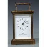 A 20thC brass carriage clock by Matthew Norman in corniche style case, the Roman enamel dial with