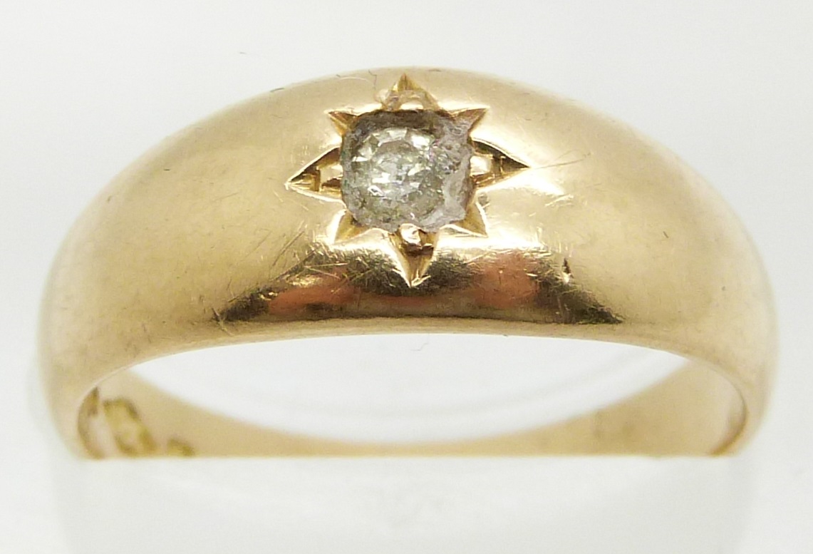 An 18ct gold ring set with paste, 4.6g, size L