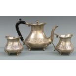 Indian white metal three piece teaset with embossed decoration, marked silver to bases, height of