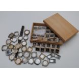 A large collection of wristwatch parts, most in original boxes together with various wristwatch