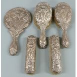 Art Nouveau hallmarked silver dressing table set comprising hand mirror and four brushes, Birmingham