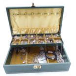 A collection of silver necklaces, bracelets and earrings in a jewellery box