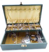A collection of silver necklaces, bracelets and earrings in a jewellery box