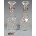 Pair of hallmarked silver mounted cut glass decanters with two hallmarked silver sherry bottle