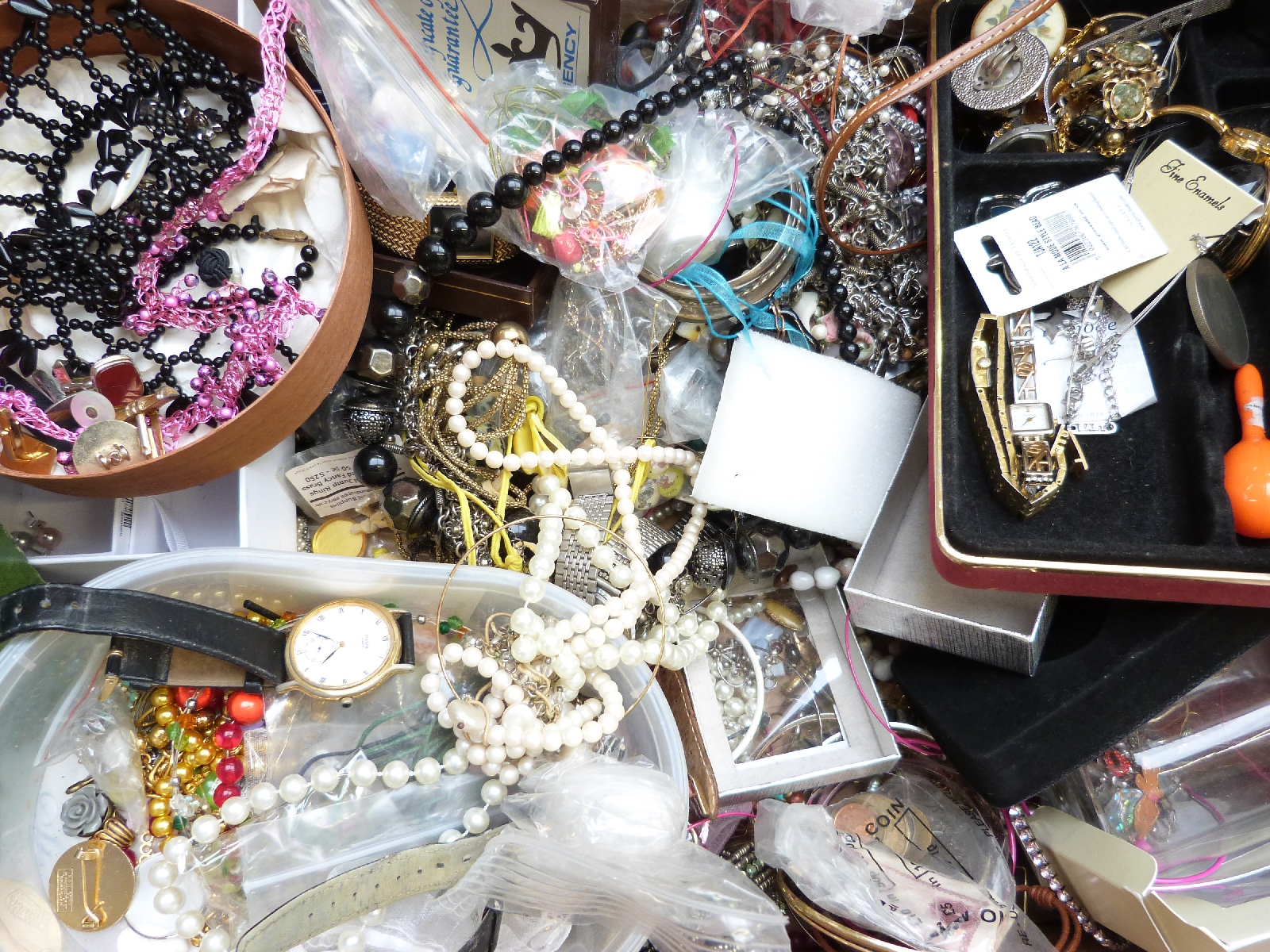 A collection of costume jewellery including rings, brooches, beads, Rolex box, coins, silver