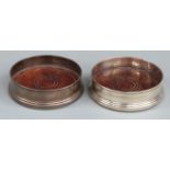 Pair of hallmarked silver wine coasters with mahogany bases, Birmingham 1982 maker K M Silver,