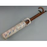 Two horn or similar handled walking sticks/canes, further walking stick and a ceramic stick stand