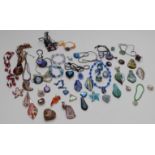 A large collection of glass pendants