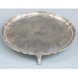 George V hallmarked silver salver with shaped edge, raised on three feet, Sheffield 1925 maker's