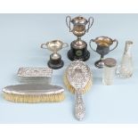 Three various hallmarked silver twin handled trophy cups, two on stands, weight of all three 180g