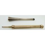 A propelling pencil and a silver cheroot holder