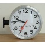 'Nextime' Jaguar two sided dial wall clock with side mounting brackets and bold Arabic numerals on
