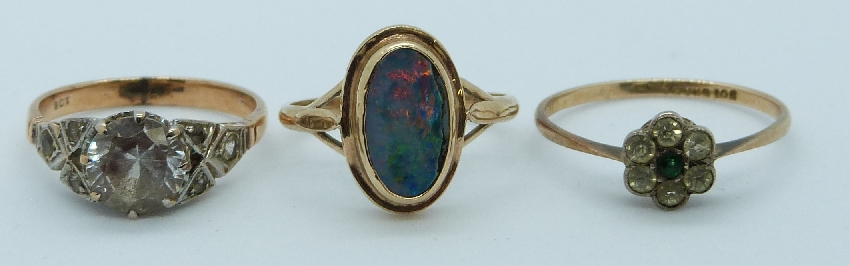 A 9ct gold ring set with opal doublet and two 9ct gold rings set with paste, 6g