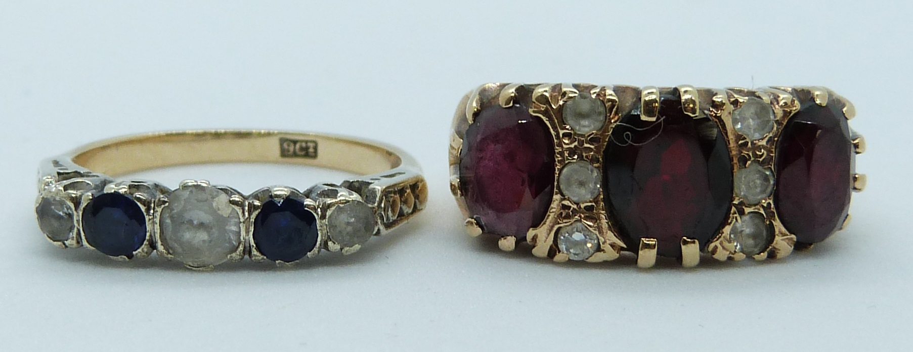 A 9ct gold ring set with sapphires and paste and a 9ct gold ring set with garnets, 7.1g