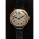 9ct gold ladies wristwatch with blued hands, black Arabic numerals and silver dial, on black leather