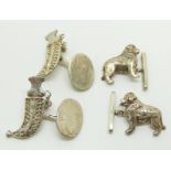 A pair of silver cufflinks in the form of dogs and a pair of white metal kukri cufflinks