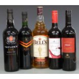 Five bottles of various wines and spirits including Bell's Scotch Whisky, 1L, 40% vol, Taylor's