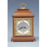 Elliott mantel clock in bell top mahogany case, the silvered Roman chapter ring with gilt cherub