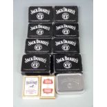 Nine packs of Jack Daniels playing cards, one pack of Stella Artois playing cards and one pack of