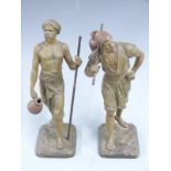 Pair of spelter models of men carrying water after Marcel Debut, signed to base, H31cm