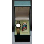 Gucci gold plated ladies wristwatch with gold hands, white dial and six interchangeable bezels of