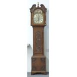 A 19thC English oak 8-day duration longcase clock with carved decoration, the silvered Roman