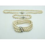 A single strand of cultured pearls with a 14ct white gold clasp set with a pearl, cultured pearl