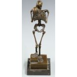 Carl Kauba bronze figure of a skeleton holding a skull, signed to base, on stepped plinth, H32cm