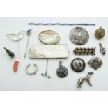 A white metal brooch set with a mother of pearl counter, Zodiac clip, Scottish Rifles brooch, Art