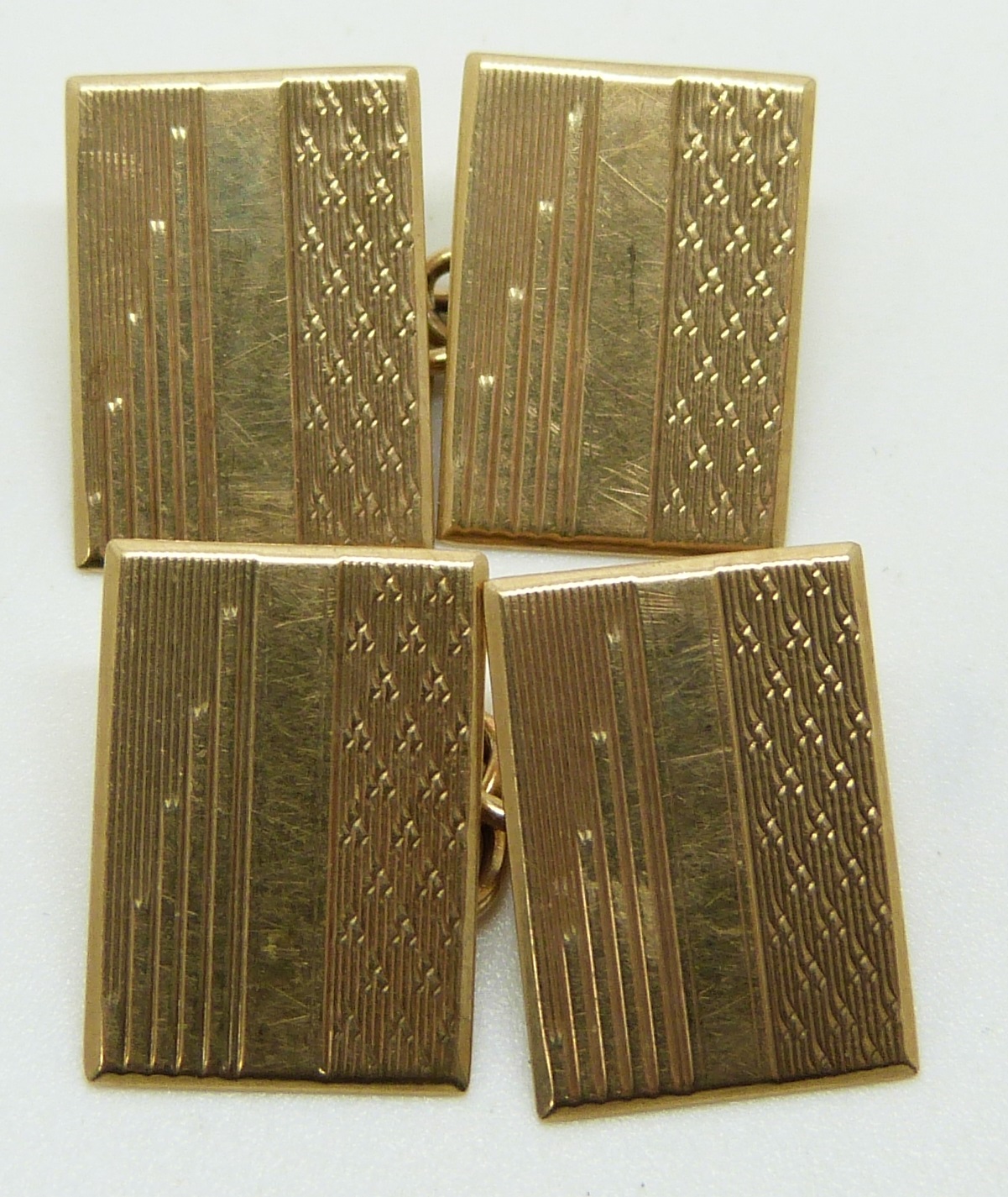 A pair of 9ct gold cufflinks with engraved Art Deco design, in original box, 3.9g