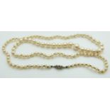 A single strand cultured pearl necklace with diamond set clasp