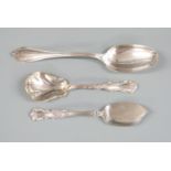 Three pieces of American white metal cutlery comprising table spoon, caddy or sugar scoop and a