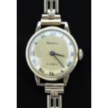 Accurist 9ct gold ladies wristwatch with black hands and Roman numerals, gold dial and 21 jewel