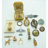 Six 9ct gold charms/ pendants comprising horseshoe, windmill, poodle, fish, football and a heart,