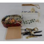 A collection of costume jewellery and watches including brooches and beads