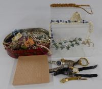 A collection of costume jewellery and watches including brooches and beads
