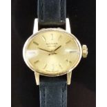 Marvin 9ct gold ladies wristwatch with gold hands, baton markers and dial and signed 17 jewel